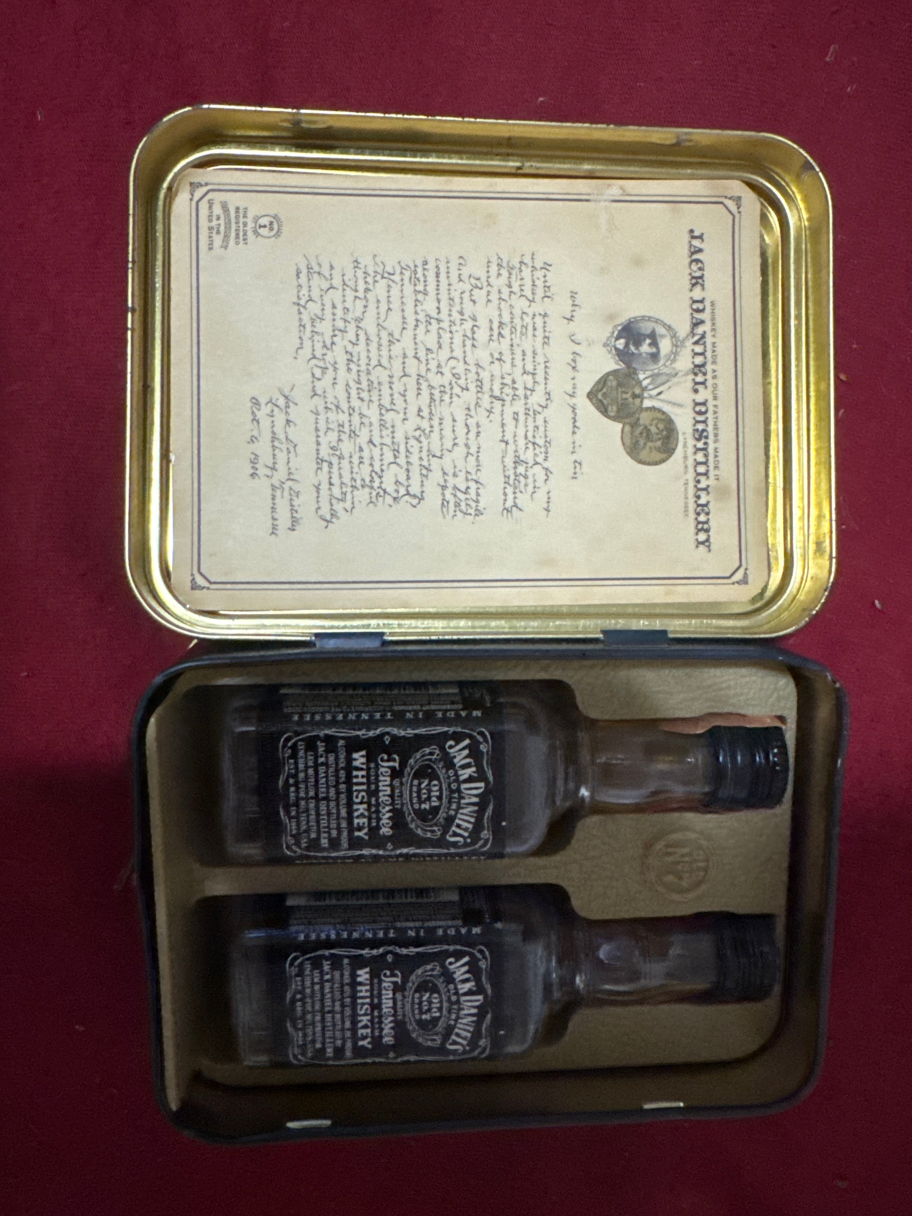Jack Daniels tin with 2 mini Jack Daniel’s bottles