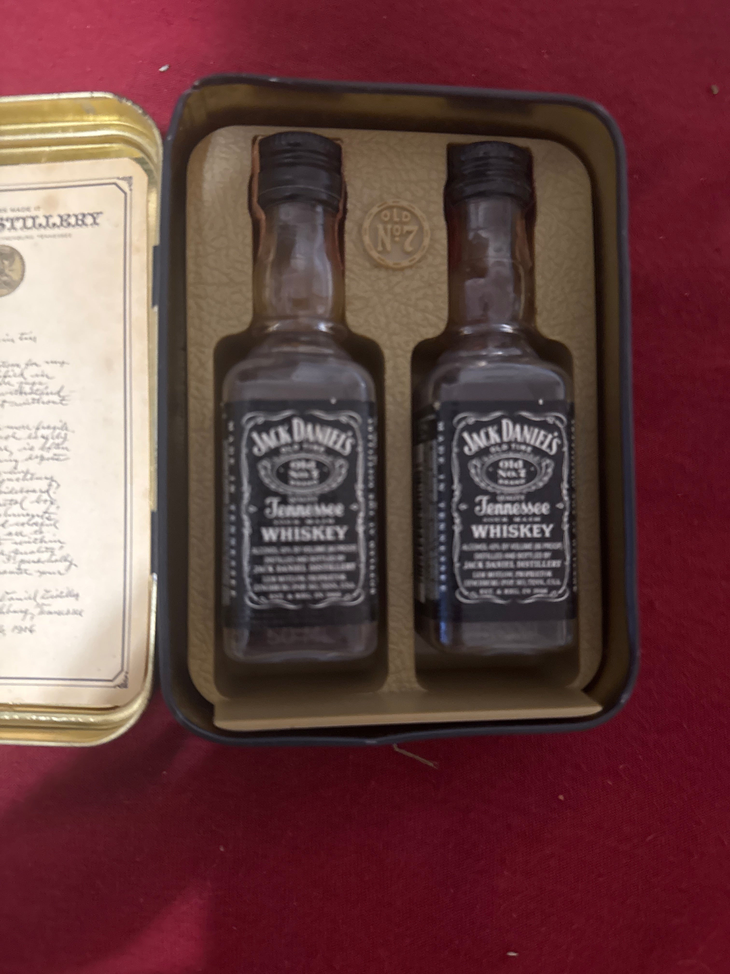Jack Daniels tin with 2 mini Jack Daniel’s bottles